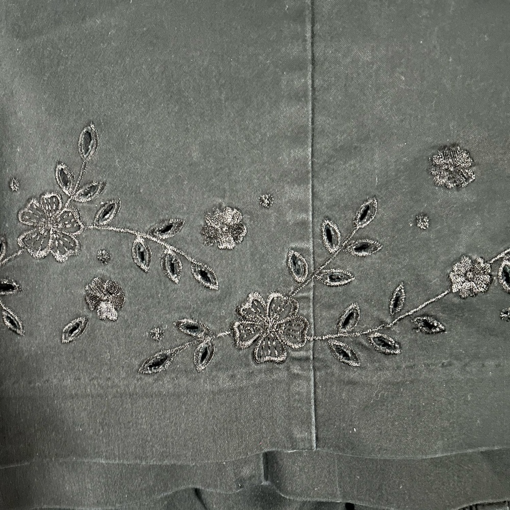 Women’s black capris with beautiful flower embroidery at the bottom of both legs